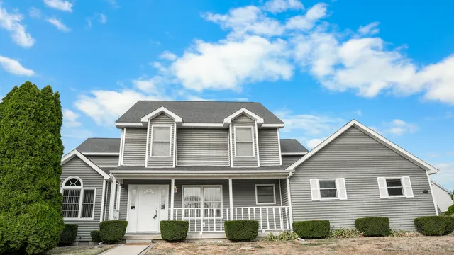 a front view of a house with garage