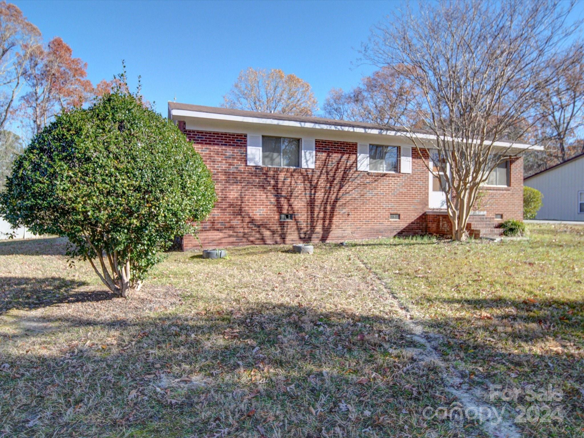 1869 State Rd S-29-584 Lancaster, SC 29720 - Photo 1 of 44 a view of a house with a yard