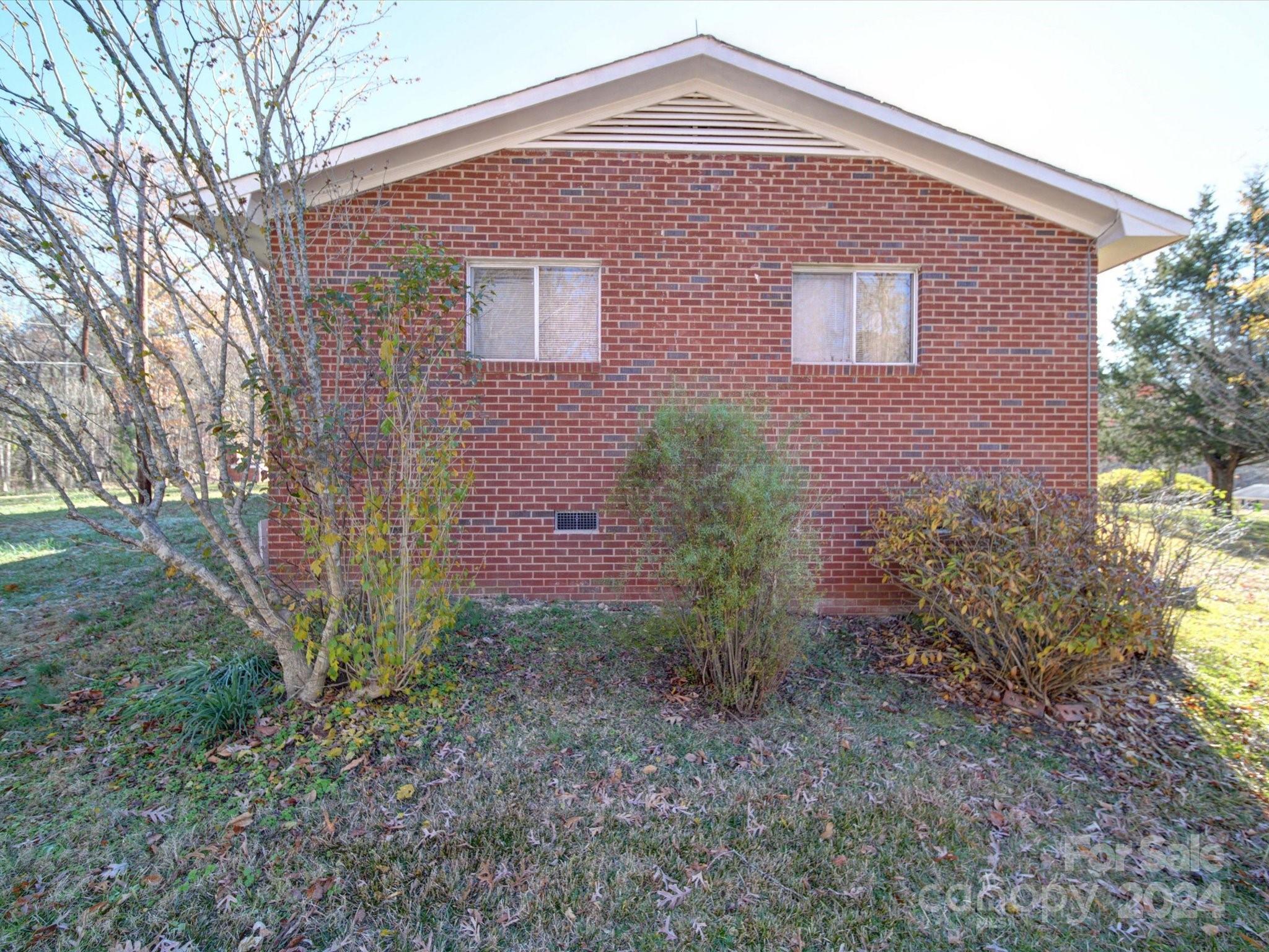 1869 State Rd S-29-584 Lancaster, SC 29720 - Photo 22 of 44 a front view of a house with garden