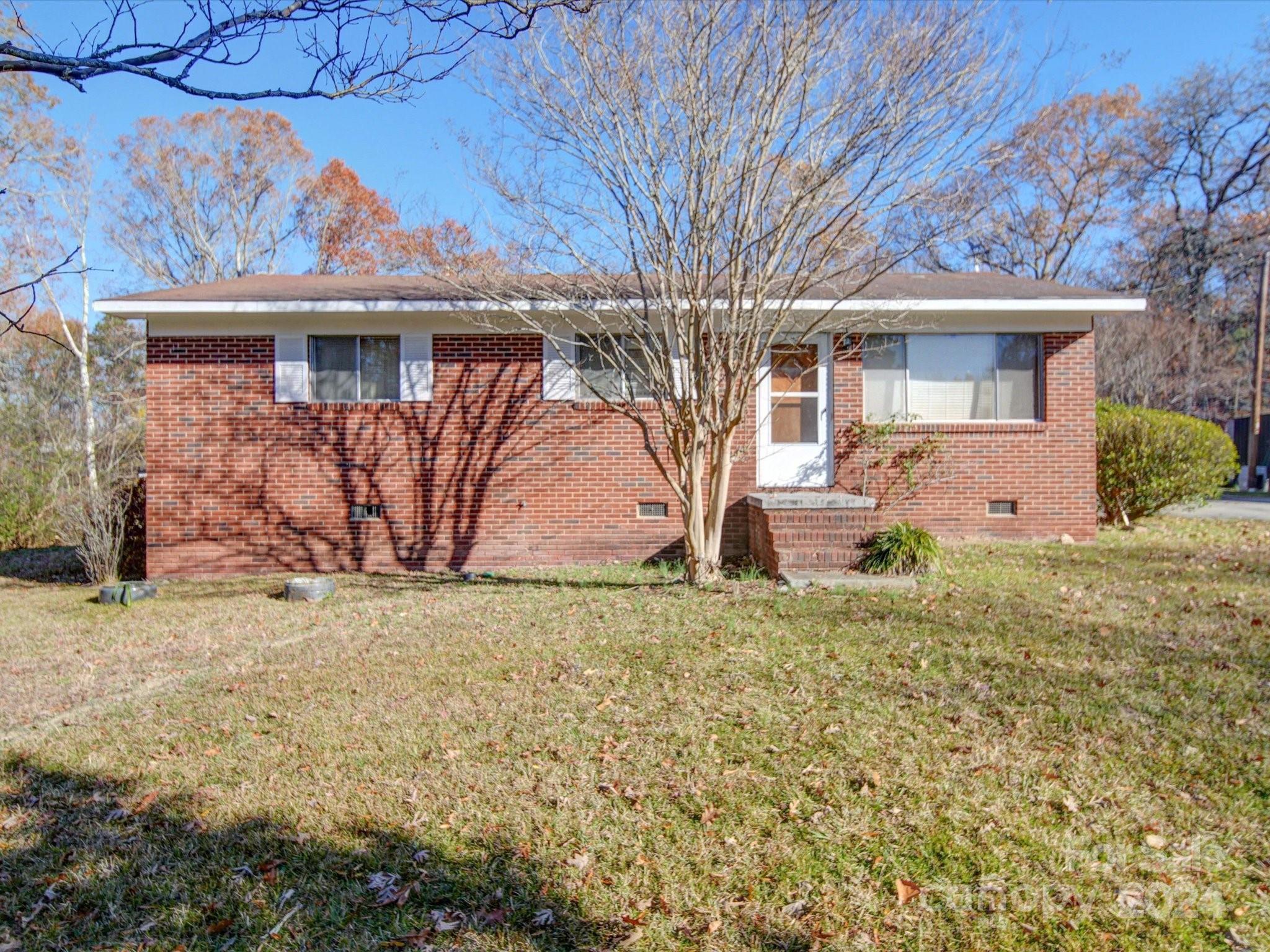 1869 State Rd S-29-584 Lancaster, SC 29720 - Photo 28 of 44 a front view of a house with garden
