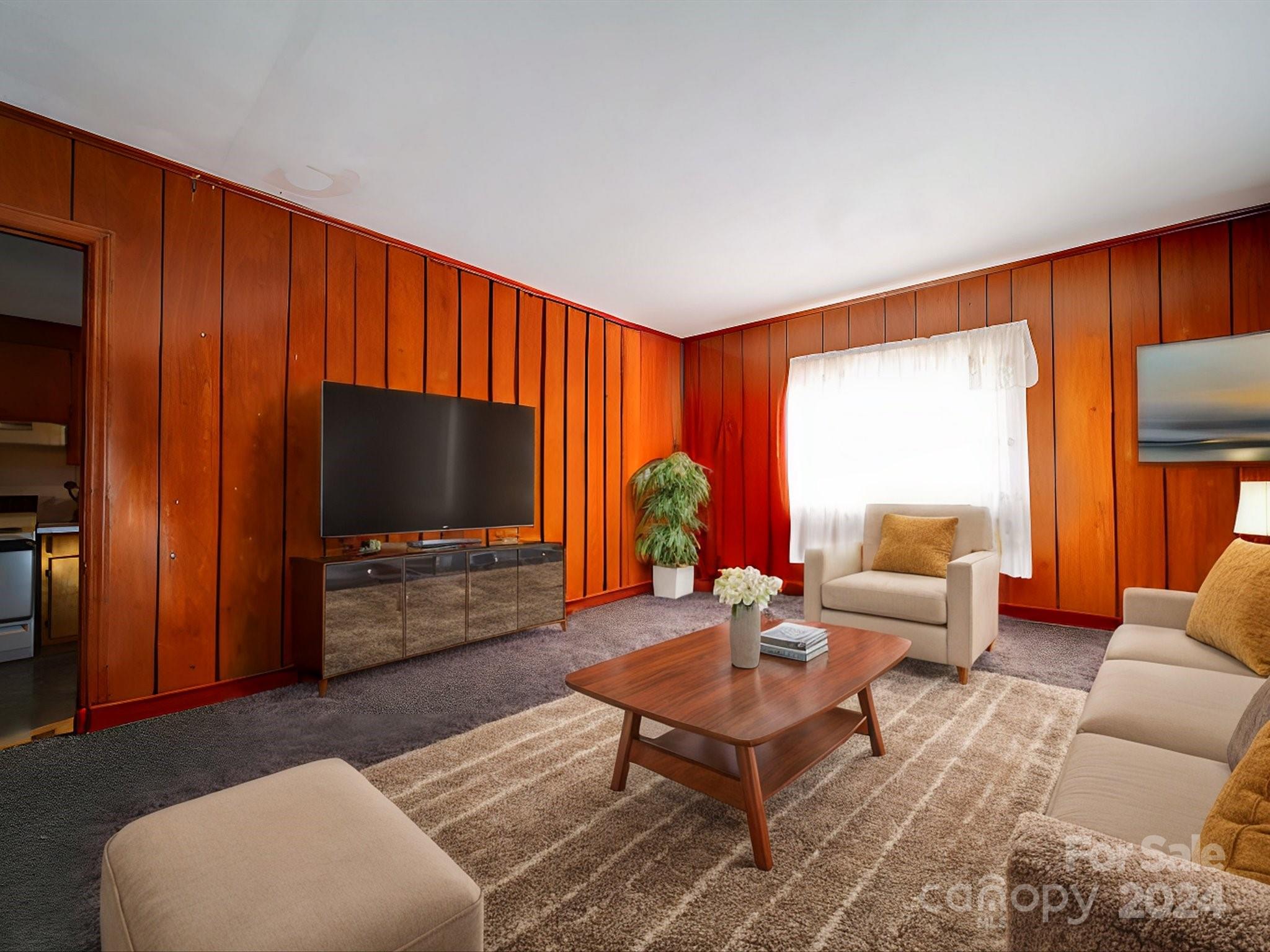 1869 State Rd S-29-584 Lancaster, SC 29720 - Photo 44 of 44 a living room with furniture a flat screen tv and a window