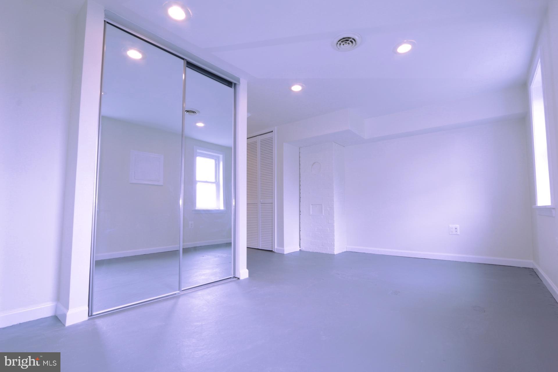 3723 South Kemper Road Arlington, VA 22206 - Photo 5 of 15 an empty room with entrance and windows