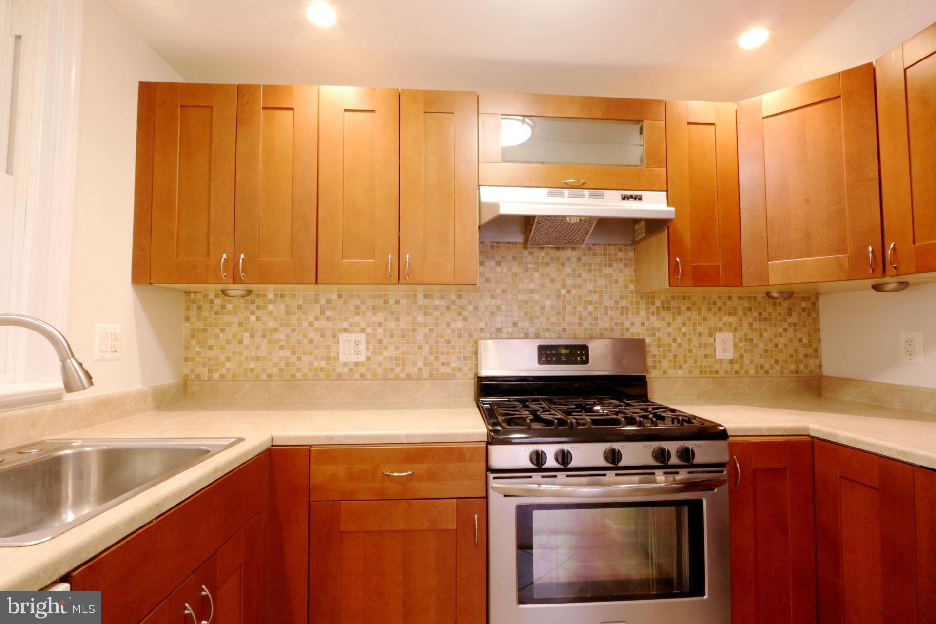 3723 South Kemper Road Arlington, VA 22206 - Photo 8 of 15 a kitchen with a stove and a sink
