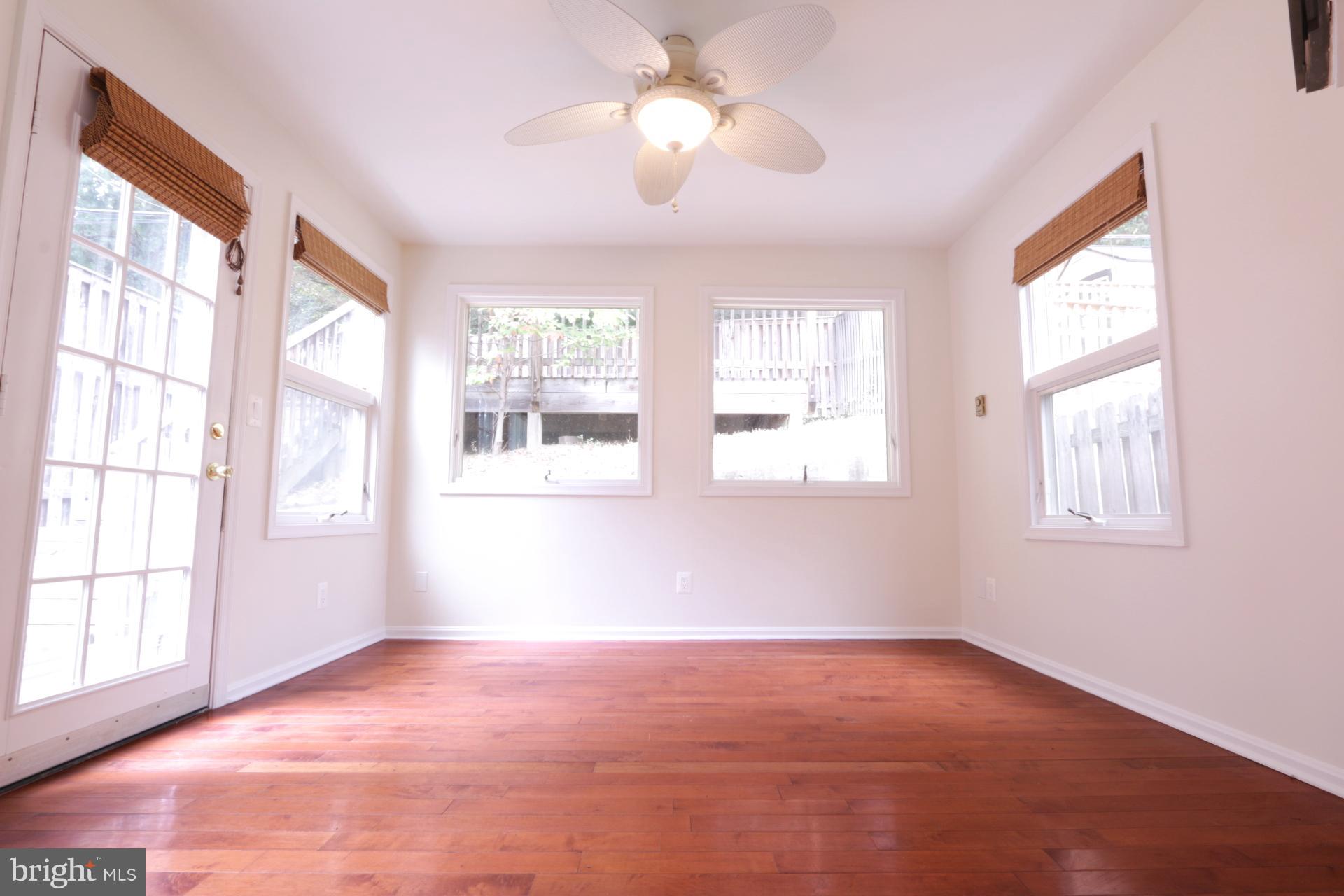3723 South Kemper Road Arlington, VA 22206 - Photo 10 of 15 a view of an empty room with a window and chandelier fan