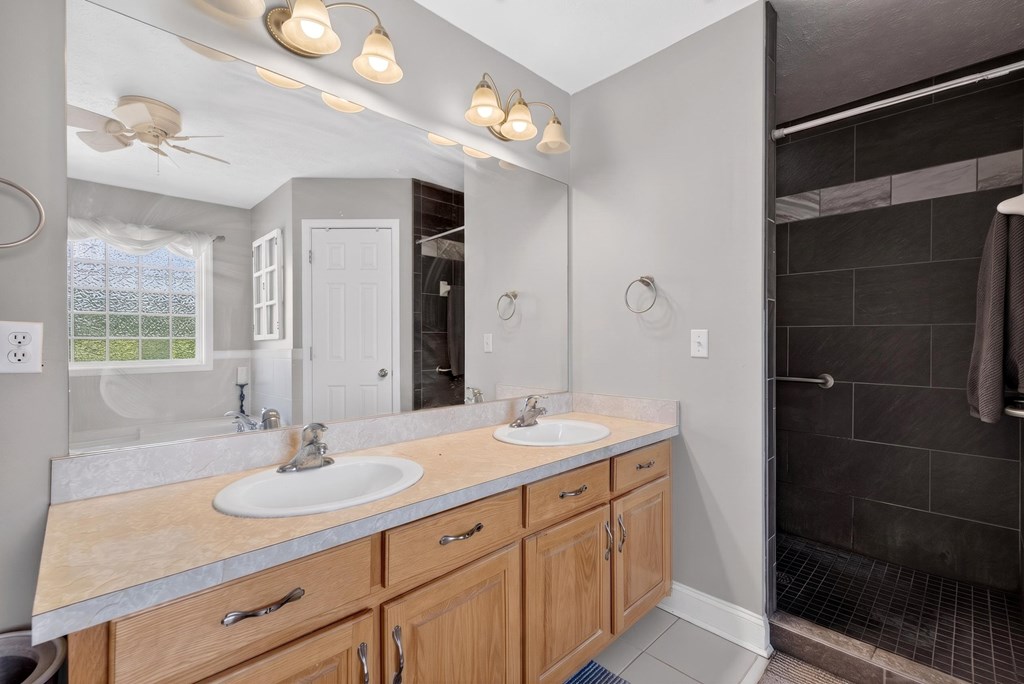 481-494 Sand Pit Road Mauk, GA 31058 - Photo 26 of 94 a bathroom with a sink double vanity and a mirror
