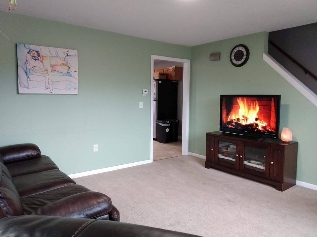 740 Bemis Road Warren, MA 01585 - Photo 11 of 30 a living room with furniture and a flat screen tv