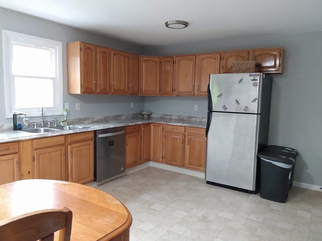 740 Bemis Road Warren, MA 01585 - Photo 8 of 30 a kitchen with a refrigerator and cabinets