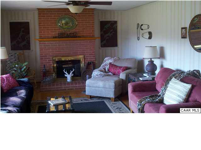 712 Kiddsville Road Waynesboro, VA 22980 - Photo 9 of 10 a living room with furniture and a fireplace