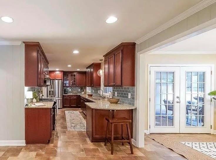 1445 Linkwood Lane Decatur, GA 30033 - Photo 11 of 30 a open kitchen with kitchen island granite countertop a sink and a refrigerator