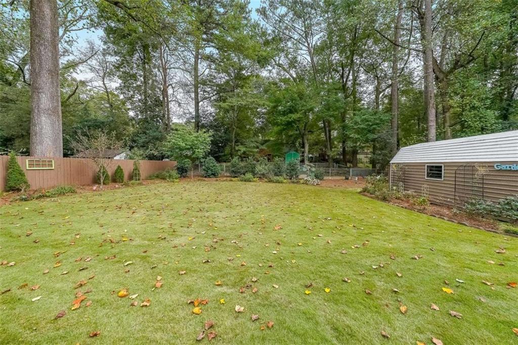 1445 Linkwood Lane Decatur, GA 30033 - Photo 24 of 30 a backyard of a house with table and chairs