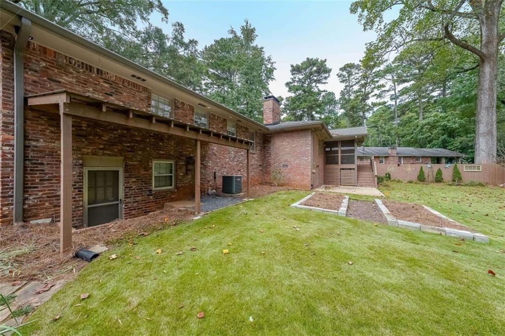 1445 Linkwood Lane Decatur, GA 30033 - Photo 26 of 30 a view of a house with a yard and sitting area