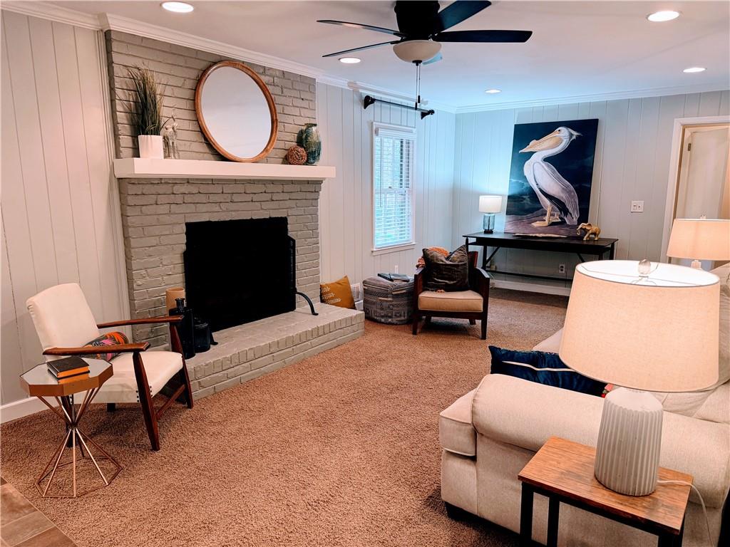 1445 Linkwood Lane Decatur, GA 30033 - Photo 6 of 30 a living room with furniture a flat screen tv and a fireplace