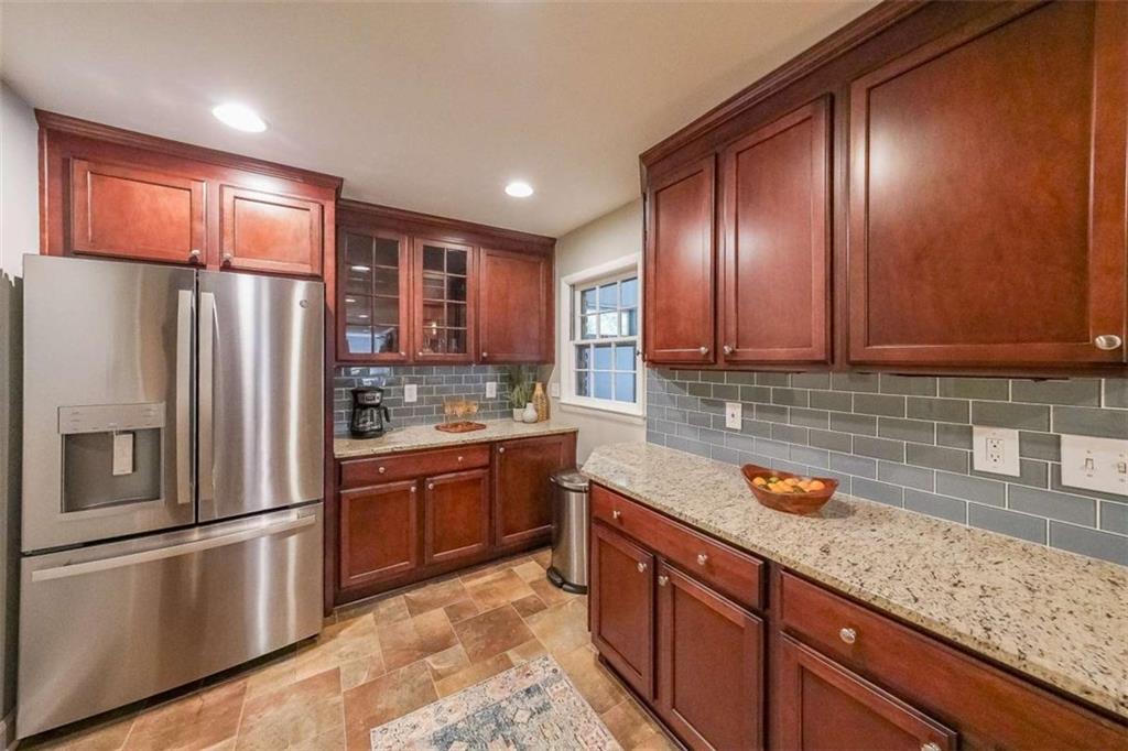 1445 Linkwood Lane Decatur, GA 30033 - Photo 10 of 30 a kitchen with stainless steel appliances granite countertop a refrigerator and a sink