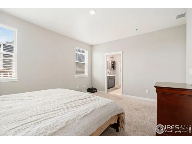 a bathroom with a sink a double vanity and a mirror