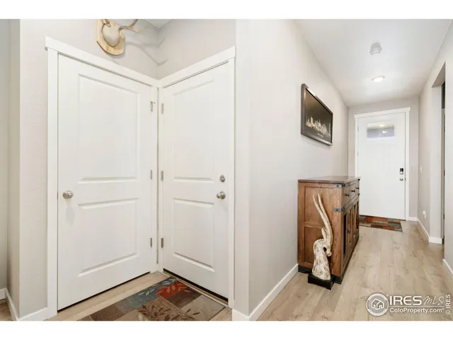 a kitchen with refrigerator and cabinets