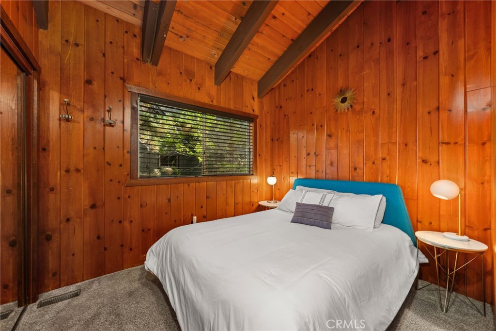 26834 Huron Road Lake Arrowhead, CA 92352 - Photo 19 of 38 a bedroom with a bed and a window