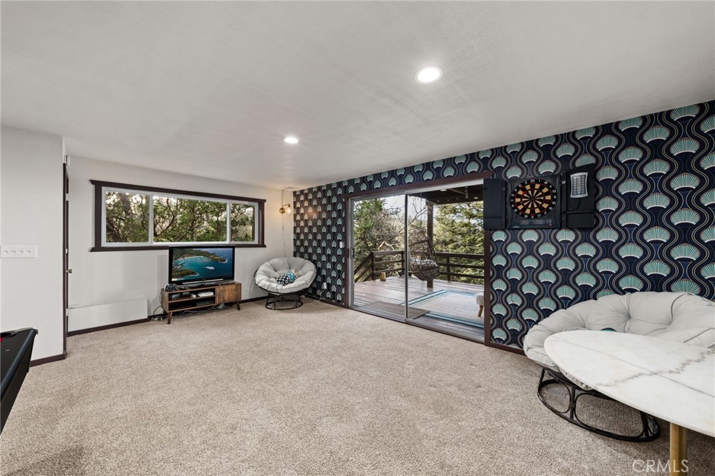 26834 Huron Road Lake Arrowhead, CA 92352 - Photo 23 of 38 a view of a room with gym equipment and a large window