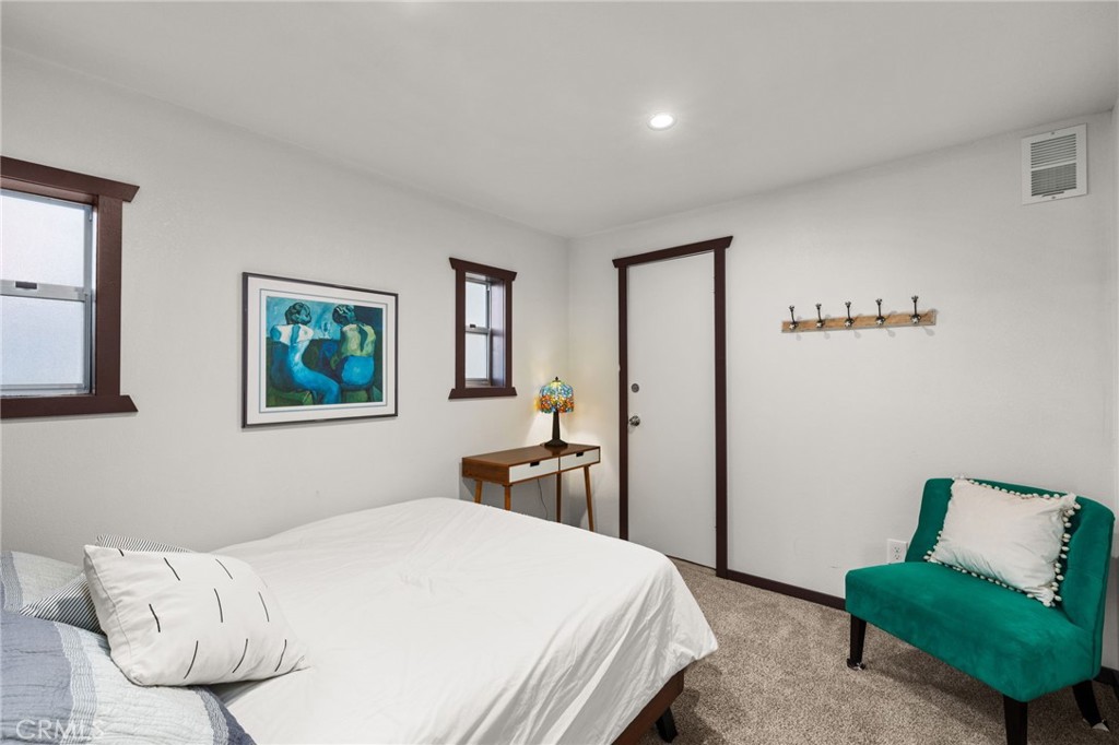 26834 Huron Road Lake Arrowhead, CA 92352 - Photo 27 of 38 a bedroom with a bed and dresser