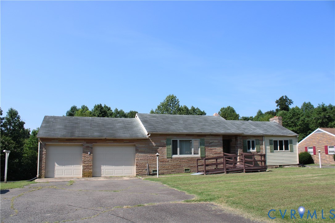 6221 Sturgeon Point Road Providence Forge, VA 23140 - Photo 2 of 26 Stone facade with a two-car garage