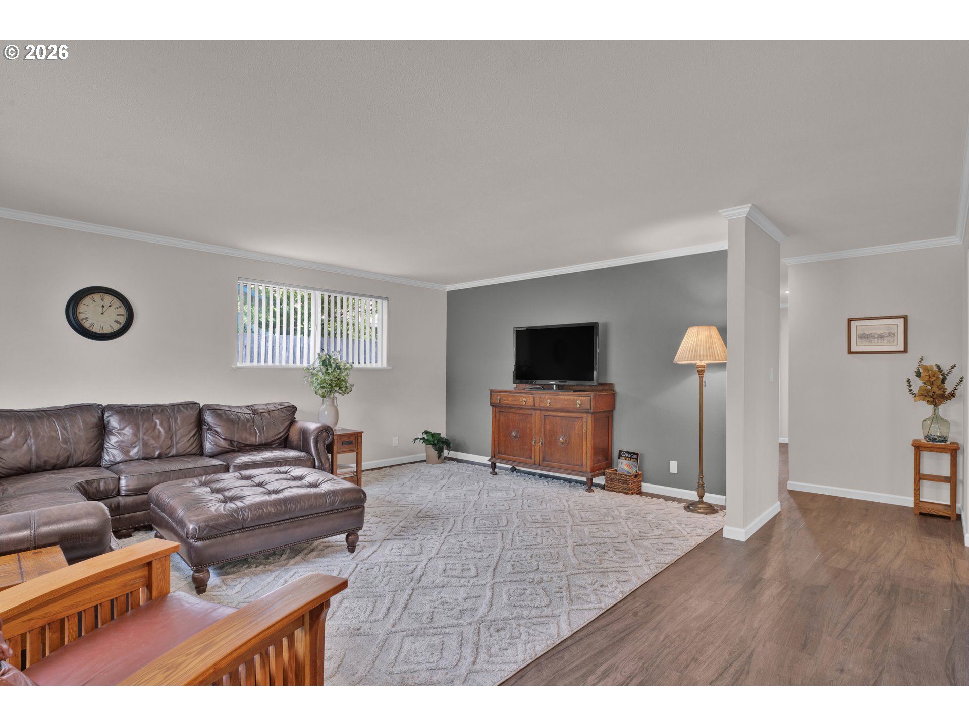 1142 9th Street Florence, OR 97439 - Photo 6 of 41 a living room with furniture and a flat screen tv