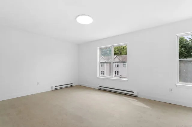 an empty room with windows