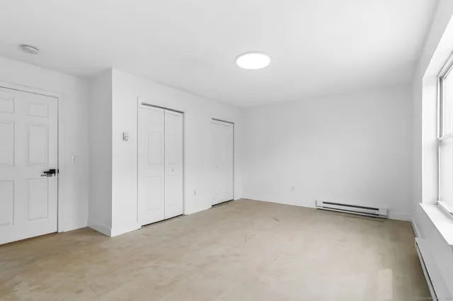 a view of an empty room and window