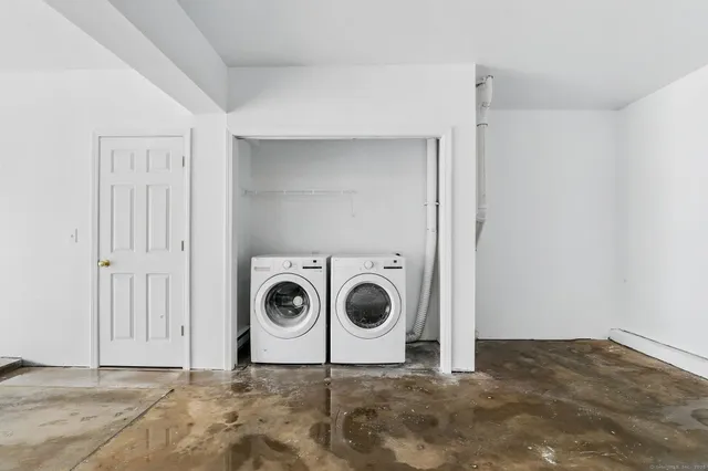 a view of a storage & utility room with washer and dryer