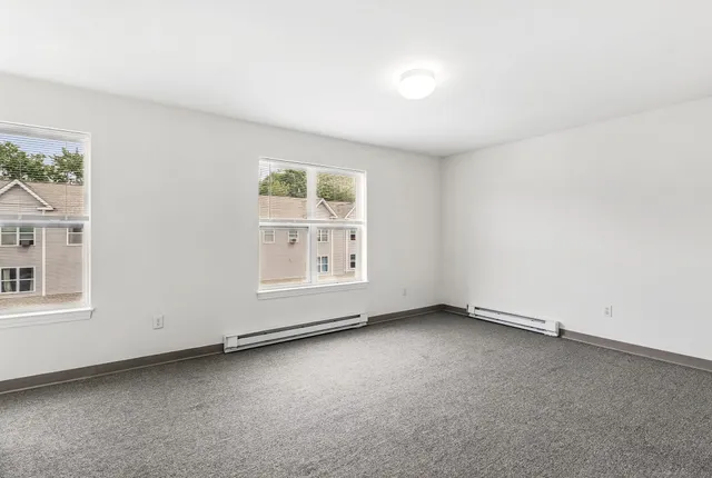 a kitchen with stainless steel appliances granite countertop a refrigerator a stove a sink and a microwave