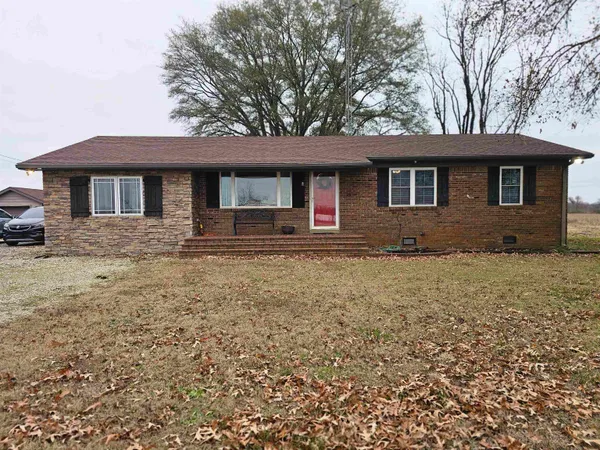 a front view of a house with yard