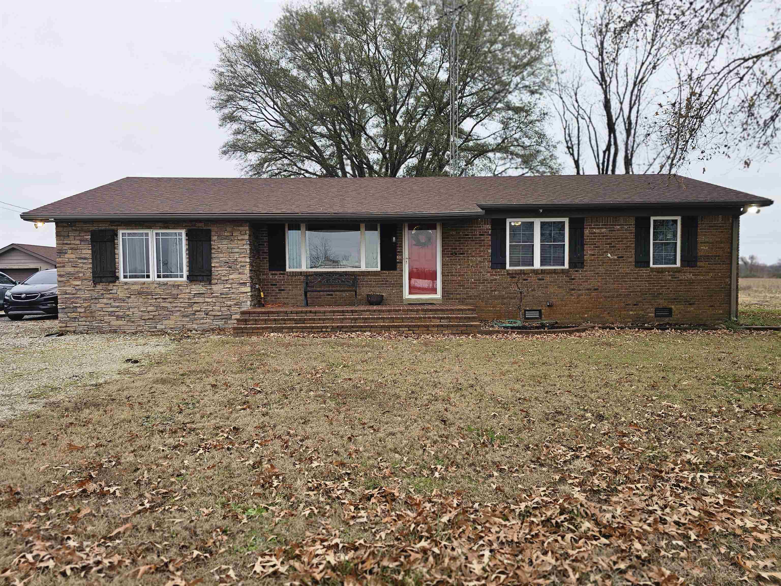 a front view of a house with yard