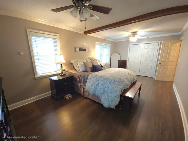 a living room with a bed furniture and a window