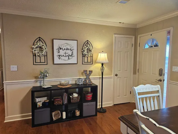 a view of a livingroom with furniture and workspace