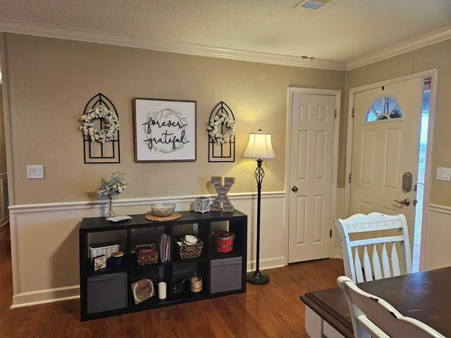 a view of a livingroom with furniture and workspace