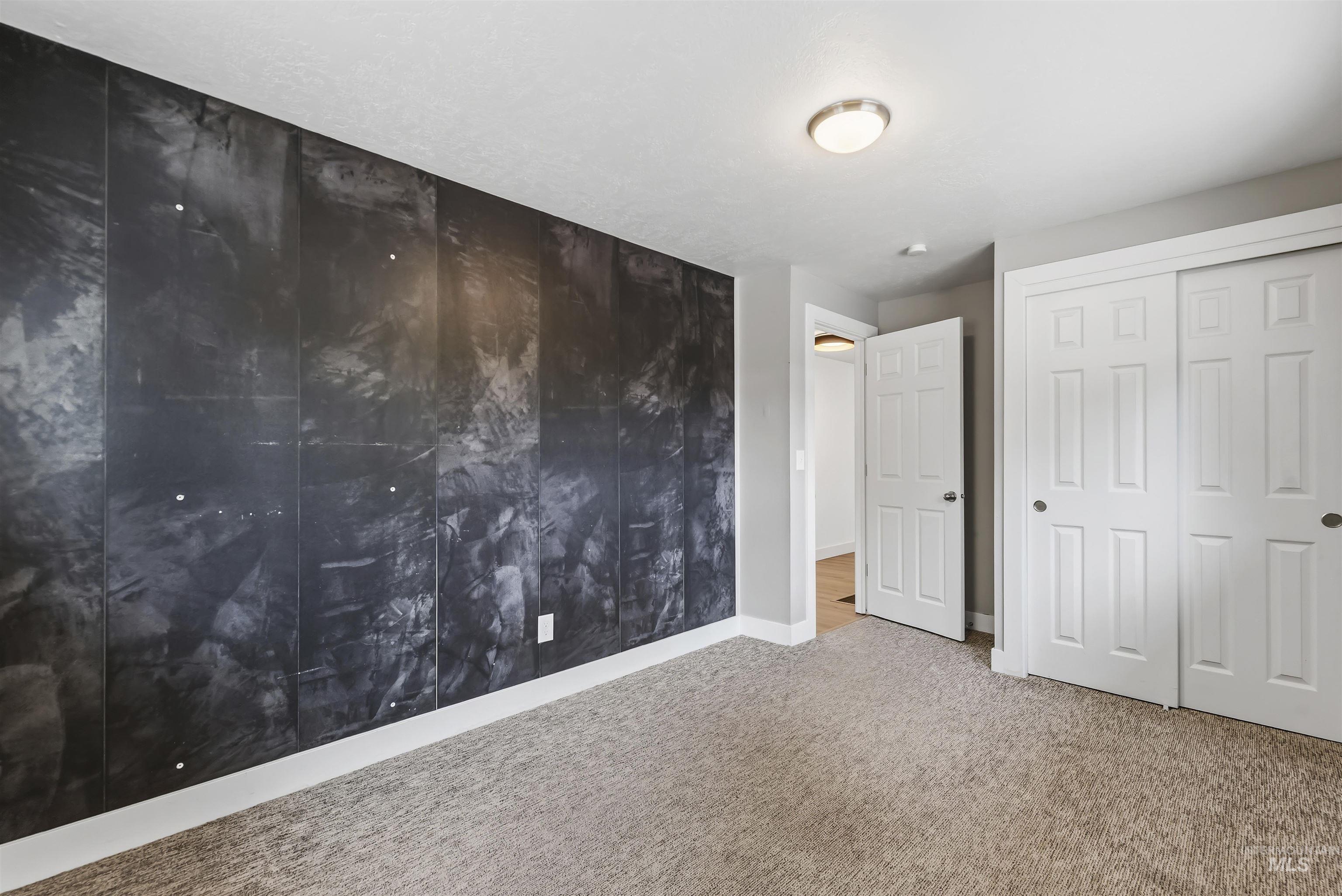 355 East Beacon Light Road Eagle, ID 83616 - Photo 22 of 47 Feature wall with a dark, textured finish