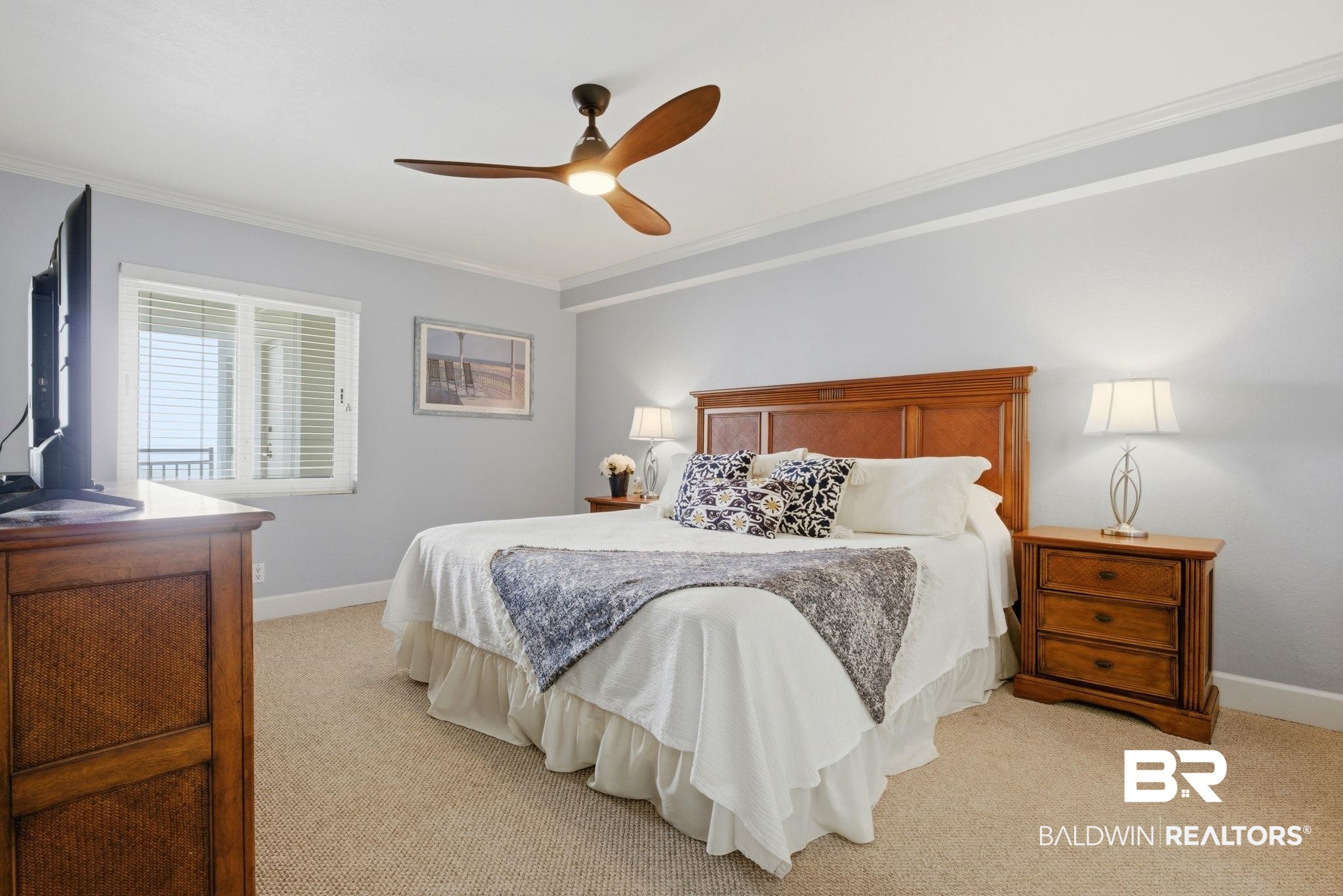 16284 Perdido Key Drive, Unit 912 Perdido Key, FL 32507 - Photo 30 of 49 Bedroom featuring ornamental molding, a ceiling fan, and light carpet