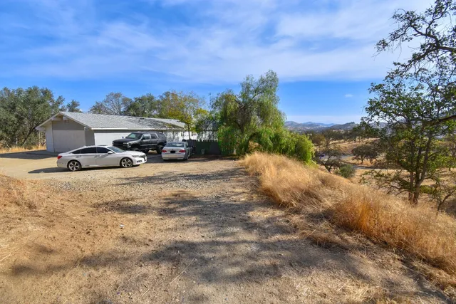 a view of car parked on the side of the road