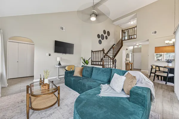 a living room with furniture and a flat screen tv