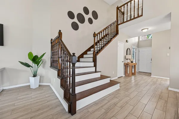 a view of entryway with wooden floor