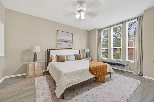 a bedroom with a large bed and a window