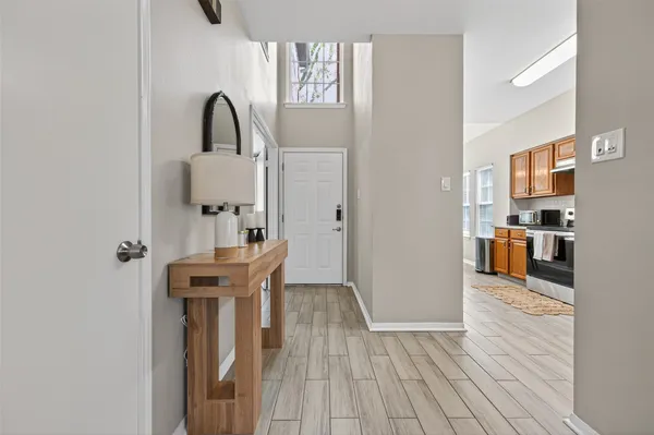 a view of a kitchen from the dinning room with furniture
