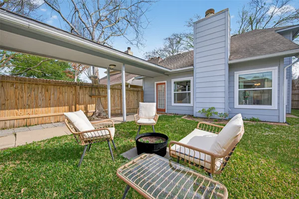 a view of a patio with a yard