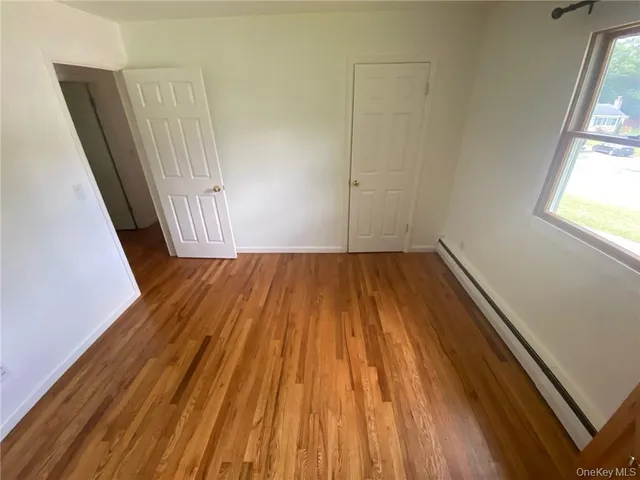 a view of an empty room with a balcony