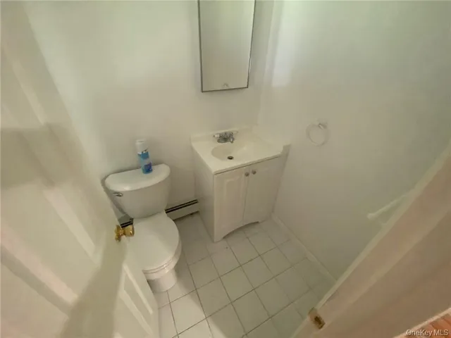 a view of a room with wooden floor and window