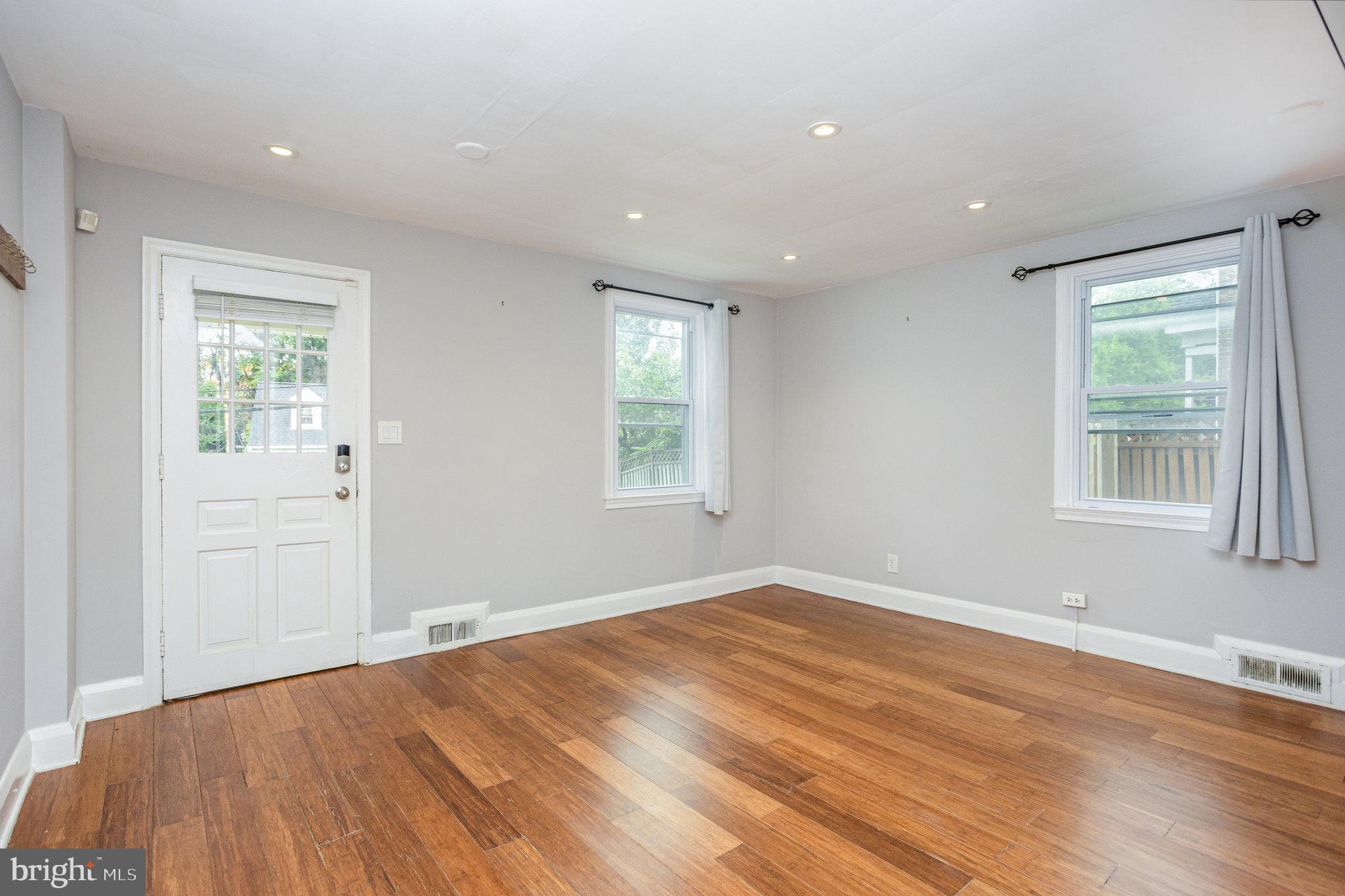 6309 Clearspring Road Baltimore, MD 21212 - Photo 3 of 18 a view of empty room with wooden floor and fan