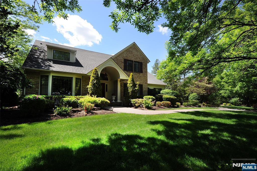 273 Joshua Lane Wyckoff, NJ 07481 - Photo 1 of 17 front view of a house with a yard