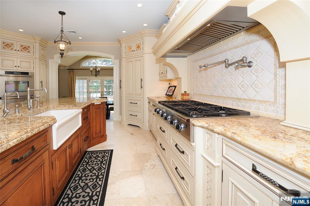273 Joshua Lane Wyckoff, NJ 07481 - Photo 14 of 17 a kitchen with stainless steel appliances granite countertop a stove and a sink