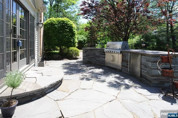 a view of a backyard with sitting area