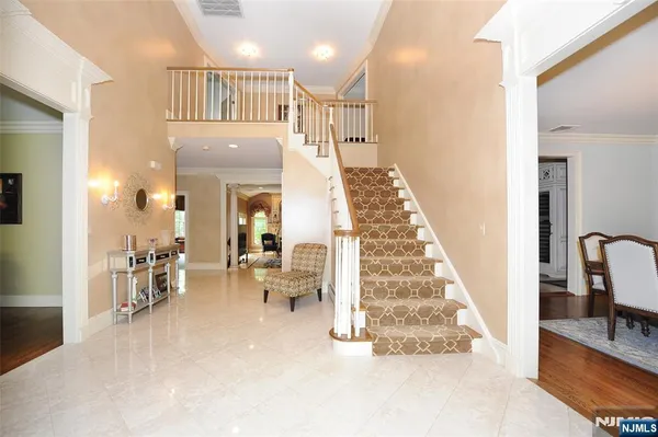 a view of a living room and dining room