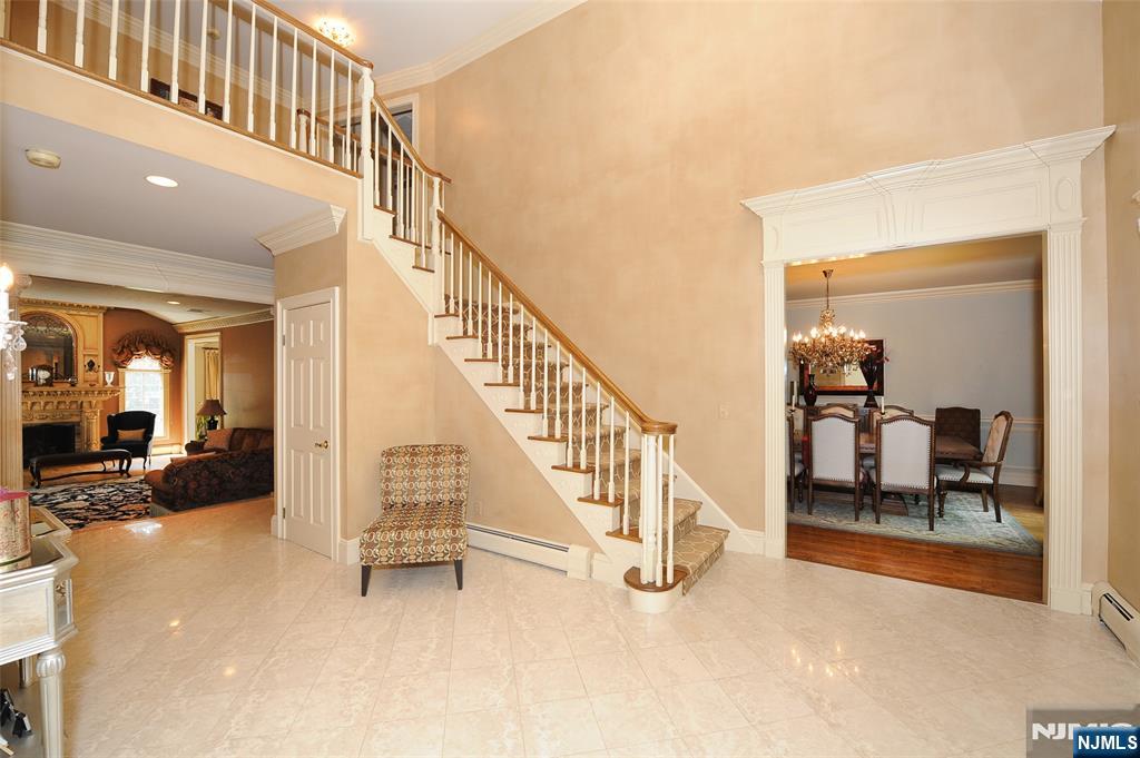 273 Joshua Lane Wyckoff, NJ 07481 - Photo 7 of 17 a view of a livingroom with wooden floor and stairs