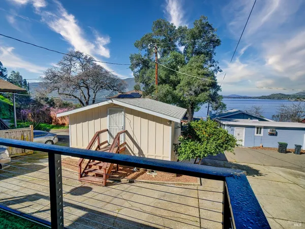 a view of a porch with furniture and wooden floors